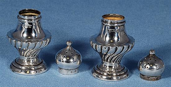 Three pairs of pepper casters.
